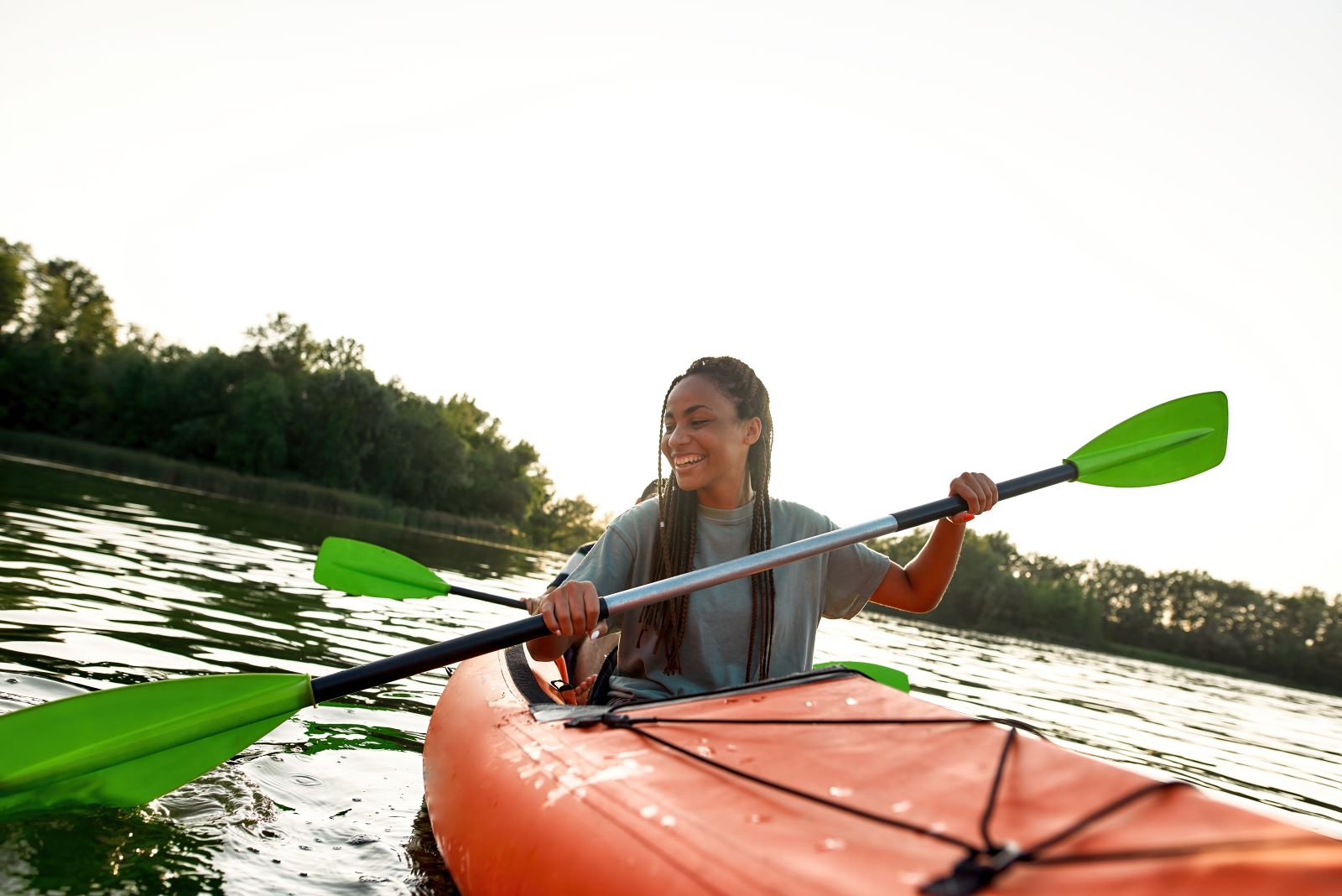 woman kayaking in a red kayak in St Augustine, FL
